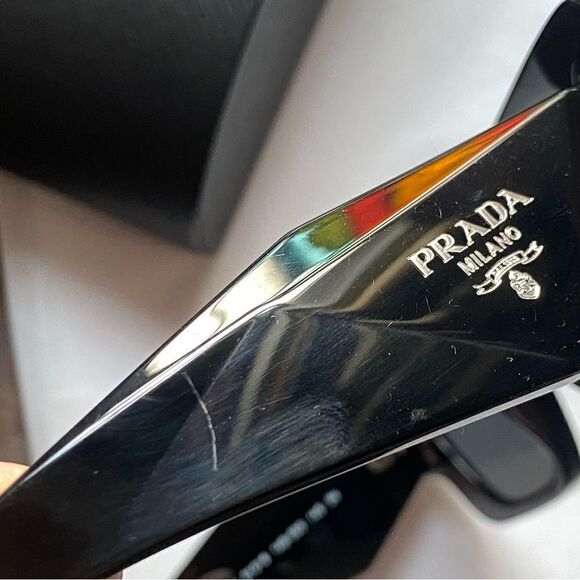 Prada Eyewear black square frame sunglasses logo sides Revolve in case $489